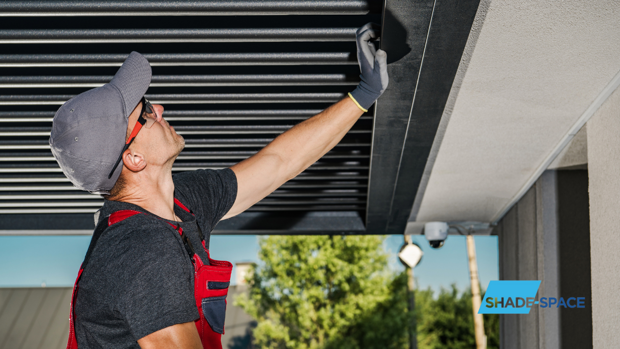 Shade Space Male Awning Expert Checking An Installed Pergola System - Shade-Space